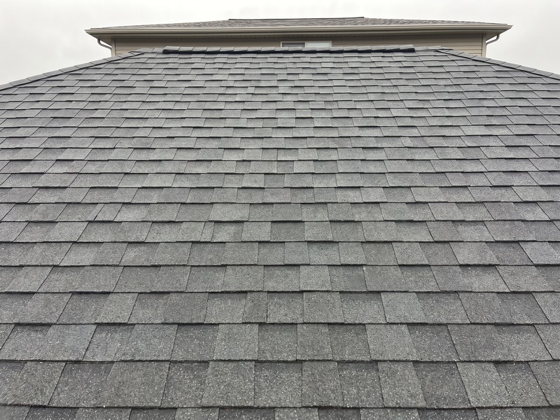Same roof section after replacement with new Class 4 impact-rated architectural shingles